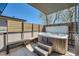 Hot tub on a patio with a sun shade and privacy fencing at 427 Milwaukee St, Denver, CO 80206