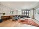 Stylish living room with hardwood floors, large sectional sofa, and plenty of natural light at 427 Milwaukee St, Denver, CO 80206
