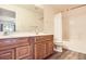 Bathroom with vanity, ample storage, and shower and tub combination at 1148 Opal St # 101, Broomfield, CO 80020