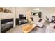 Cozy living room with fireplace, plush seating, and ample natural light at 1148 Opal St # 101, Broomfield, CO 80020
