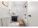 Bathroom features modern black fixtures and sleek white tiling at 2713 S Hazel Ct, Denver, CO 80236
