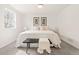 Neutral-toned bedroom featuring a king bed and natural light from a window at 2713 S Hazel Ct, Denver, CO 80236