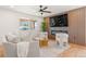 Inviting living room with a modern fireplace, wood accents and hardwood floors at 2713 S Hazel Ct, Denver, CO 80236