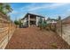 Spacious backyard featuring a deck, mature trees, privacy fencing, and a well-maintained lawn at 5420 Baseline Rd, Boulder, CO 80303