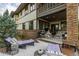 Backyard featuring a patio with lounge chairs, a seating area with a fireplace, and a grill at 5420 Baseline Rd, Boulder, CO 80303