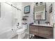 Stylish bathroom featuring a glass-enclosed shower, modern vanity, and decorative tile flooring at 5420 Baseline Rd, Boulder, CO 80303