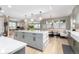 Kitchen island overlooks the dining nook and the living area in this open-concept design at 5420 Baseline Rd, Boulder, CO 80303