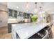 Kitchen island featuring bar stool seating and decorative pendant lighting. Stainless appliances at 5420 Baseline Rd, Boulder, CO 80303