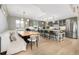 Bright kitchen features gray cabinetry, stainless steel appliances, and a large island with seating at 5420 Baseline Rd, Boulder, CO 80303