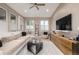 Comfortable living room offering lots of natural light, cozy seating, and a ceiling fan at 5420 Baseline Rd, Boulder, CO 80303