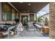 Outdoor living area featuring a grill, teepee, comfortable seating, and stone fireplace at 5420 Baseline Rd, Boulder, CO 80303