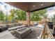 Covered outdoor space showcasing a fire pit, comfortable lounge seating, and modern decor at 5420 Baseline Rd, Boulder, CO 80303