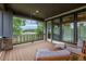 Relaxing covered patio with outdoor furniture and a view of the street at 5420 Baseline Rd, Boulder, CO 80303