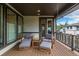 Cozy covered patio with outdoor furniture and a view of the yard at 5420 Baseline Rd, Boulder, CO 80303