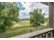 Scenic view from the deck overlooking lush greenery, a playground, and distant mountains at 5420 Baseline Rd, Boulder, CO 80303