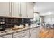 Kitchen with granite countertops and coffee bar area at 13795 W Center Dr, Lakewood, CO 80228