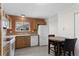 Bright kitchen featuring wood floors, countertops, and modern appliances at 23 Shetland Ct, Highlands Ranch, CO 80130