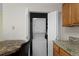 An open closet with a stackable washer and dryer unit at 23 Shetland Ct, Highlands Ranch, CO 80130