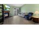 Bright living room with wood floors, fireplace, and access to the patio at 23 Shetland Ct, Highlands Ranch, CO 80130