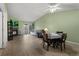 Bright living room with wood floors, a fireplace, and dining area at 23 Shetland Ct, Highlands Ranch, CO 80130