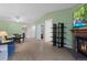 Open-concept living area with dining room, fireplace, and wood floors at 23 Shetland Ct, Highlands Ranch, CO 80130