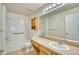 Full bathroom featuring a shower-tub combo, vanity, and large mirror at 930 Button Rock Dr # 29, Longmont, CO 80504