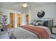Bedroom featuring a study desk and a king bed with access to the bathroom and closet at 930 Button Rock Dr # 29, Longmont, CO 80504
