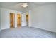 This bedroom offers bathroom and closet access and a ceiling fan at 930 Button Rock Dr # 29, Longmont, CO 80504