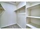 Walk-in closet with built-in shelving and hanging rods for ample storage space at 930 Button Rock Dr # 29, Longmont, CO 80504
