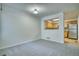 Open dining area showcasing views into the kitchen with white walls and gray carpet at 930 Button Rock Dr # 29, Longmont, CO 80504