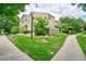 Inviting two-story townhouse with lush landscaping and a well-maintained lawn at 930 Button Rock Dr # 29, Longmont, CO 80504