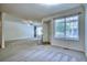 Open living room featuring cozy fireplace and large windows at 930 Button Rock Dr # 29, Longmont, CO 80504