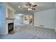 Spacious living room with fireplace and views into the kitchen and dining areas at 930 Button Rock Dr # 29, Longmont, CO 80504
