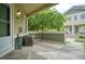Cozy covered patio with an air conditioning unit, providing a relaxing outdoor space for seating and entertaining at 930 Button Rock Dr # 29, Longmont, CO 80504
