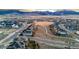 Expansive aerial view of a well-planned community surrounded by scenic mountains, showcasing a peaceful and picturesque neighborhood at 19495 W 94Th Ave, Arvada, CO 80007