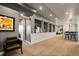 Finished basement with neutral decor, a bar area, and plenty of room for entertaining at 19495 W 94Th Ave, Arvada, CO 80007
