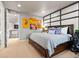 Cozy bedroom with custom wall feature, plush carpeting, and ample closet space at 19495 W 94Th Ave, Arvada, CO 80007