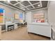 Comfortable bedroom with contemporary design, featuring plush carpets and a tray ceiling at 19495 W 94Th Ave, Arvada, CO 80007