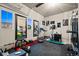 Fully equipped home gym with mirrors, various exercise machines, and fitness equipment for a complete workout experience at 19495 W 94Th Ave, Arvada, CO 80007
