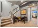 Hallway featuring stairs, artwork, and decor with an open view to the bedroom at 19495 W 94Th Ave, Arvada, CO 80007