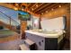 Relaxing hot tub with views and an outdoor TV, creating the perfect space for unwinding and enjoying the outdoors at 19495 W 94Th Ave, Arvada, CO 80007