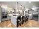 Spacious kitchen with a large island, modern stainless steel appliances, and sleek cabinets at 19495 W 94Th Ave, Arvada, CO 80007
