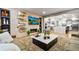 Open-concept living room view to the kitchen, showcasing modern finishes and spacious design at 19495 W 94Th Ave, Arvada, CO 80007