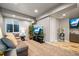Cozy living room with a comfortable couch, large TV, and a charming popcorn machine for movie nights at 19495 W 94Th Ave, Arvada, CO 80007
