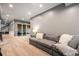 Spacious living room featuring recessed lighting, plush carpeting, and large sliding glass doors for natural light at 19495 W 94Th Ave, Arvada, CO 80007