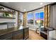 Comfortable home office with a large desk, stylish chair and a large window view at 19495 W 94Th Ave, Arvada, CO 80007