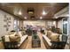 Relaxing covered patio features comfortable seating, a dining area, and outdoor grill at 19495 W 94Th Ave, Arvada, CO 80007