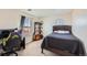Well-lit bedroom with a double bed, workspace, and window at 3805 Windriver Trl, Castle Rock, CO 80109