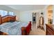 Main bedroom with a king-size bed and access to the bathroom at 3805 Windriver Trl, Castle Rock, CO 80109