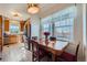 Kitchen dining area with table and chairs, offering a view from the window at 3805 Windriver Trl, Castle Rock, CO 80109